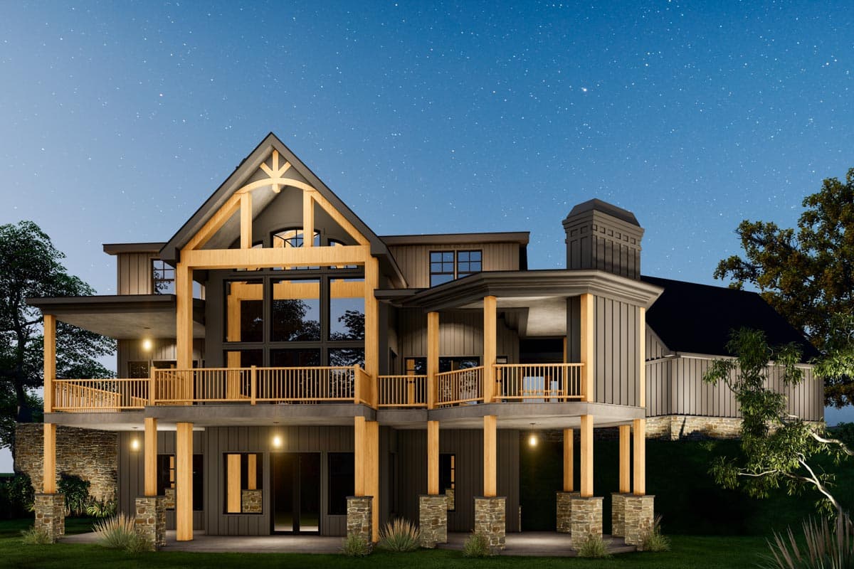 Modern house plan exterior with dramatic gables, exposed wood beams, large windows, and multiple covered decks.