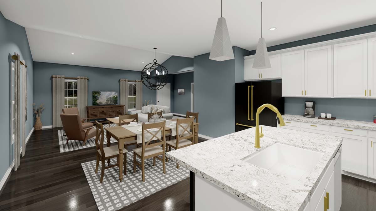 Open concept kitchen, dining, and living area with vaulted ceiling, kitchen island, and fireplace.