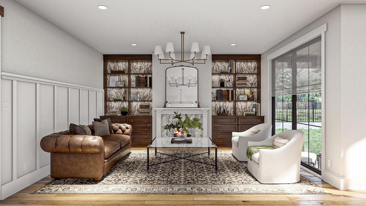 Living room with fireplace, built-in bookshelves, tufted leather sofa, and large windows.