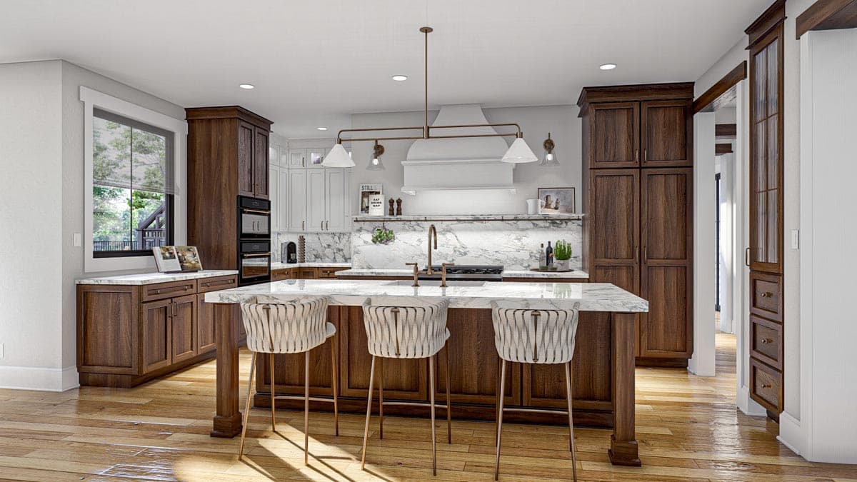 Kitchen with island, marble countertops, dark wood cabinets, and white upper cabinets with range hood.