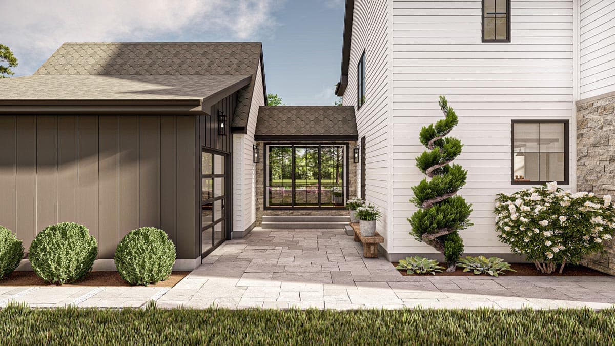 Modern Farmhouse house plan exterior with attached garage, side entrance, and two stories with stone and lap siding.