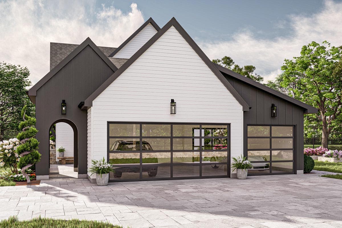 Modern Farmhouse house plan exterior with two stories, dark siding, white horizontal siding, and glass garage doors.