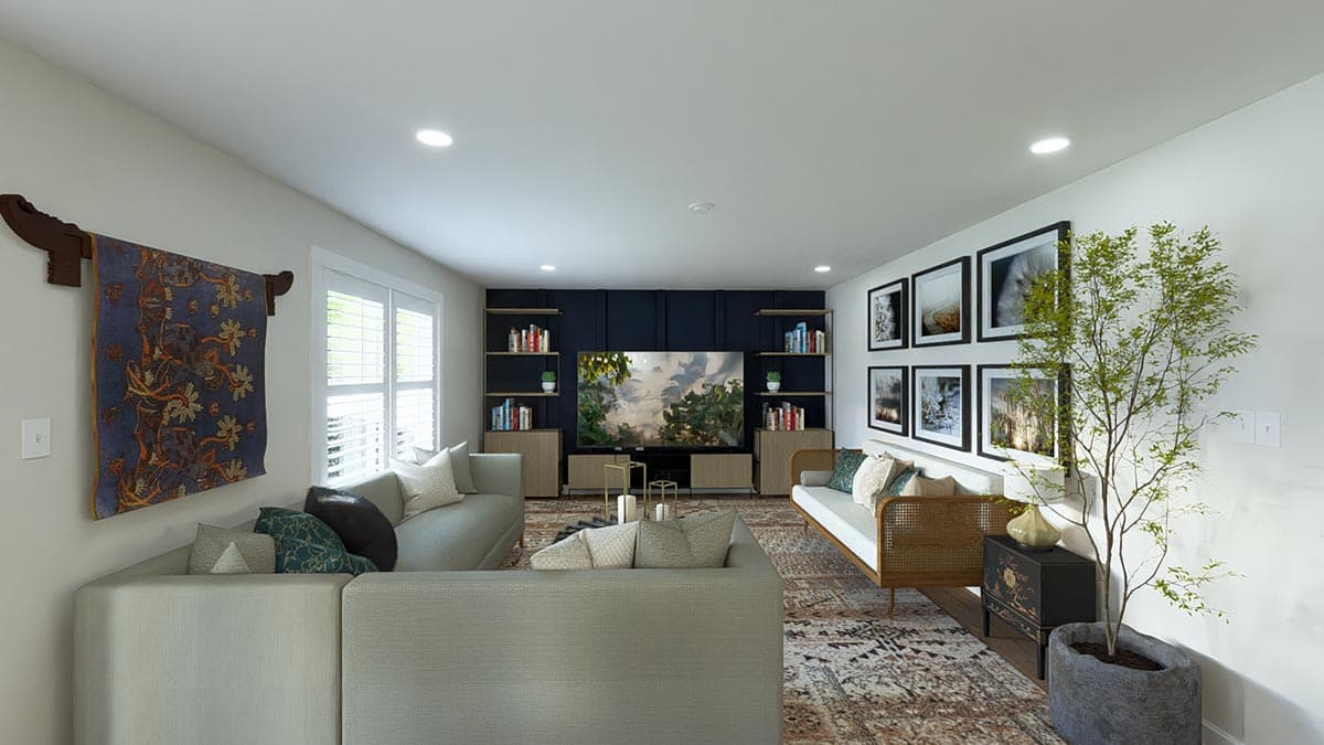Living room with sectional sofa, entertainment center, bookshelves, and a gallery wall.