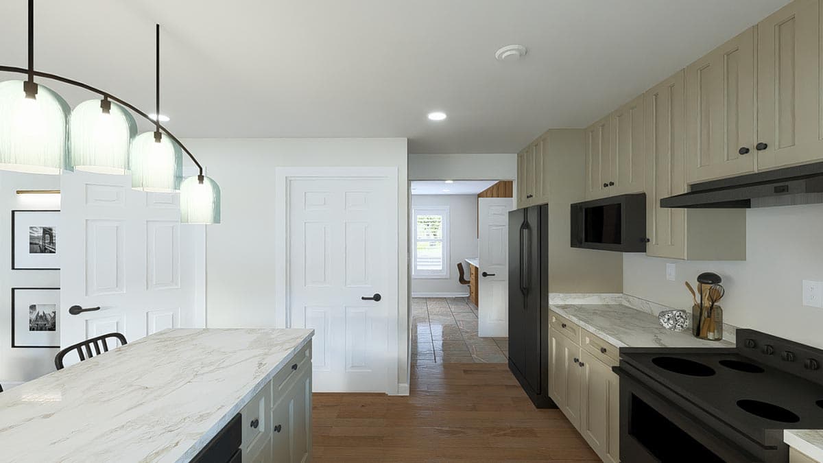 Kitchen with marble island, light wood floors, and neutral cabinetry. View shows doorway to dining area.