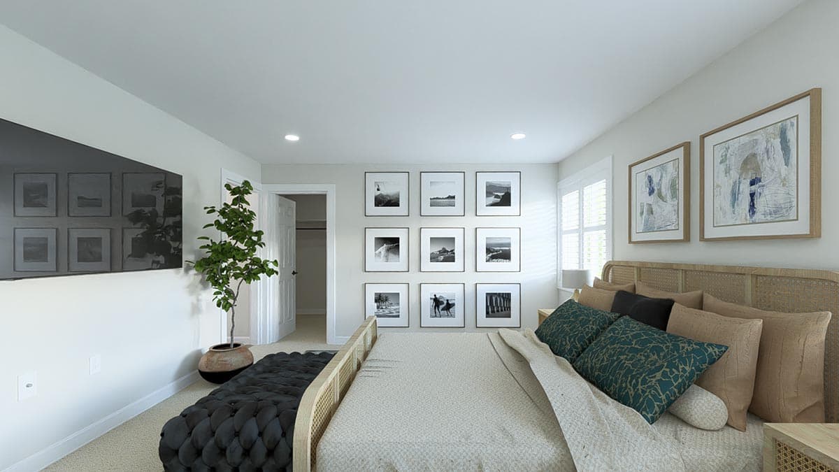 Primary bedroom with king-size bed, rattan headboard, wall gallery, and television.