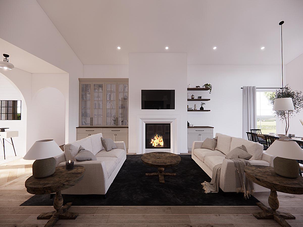 A modern living room featuring a fireplace with a lit fire, two matching sofas, and two wooden side tables with lamps. A dark rug grounds the space.