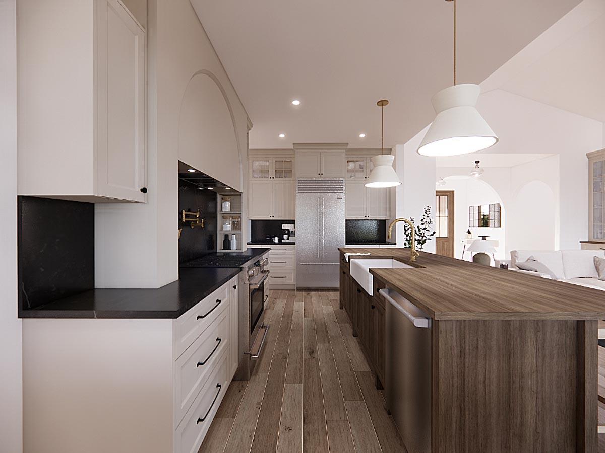Spacious, modern kitchen featuring white cabinetry, dark countertops, a large island with a sink, and hardwood floors extending to the living area.