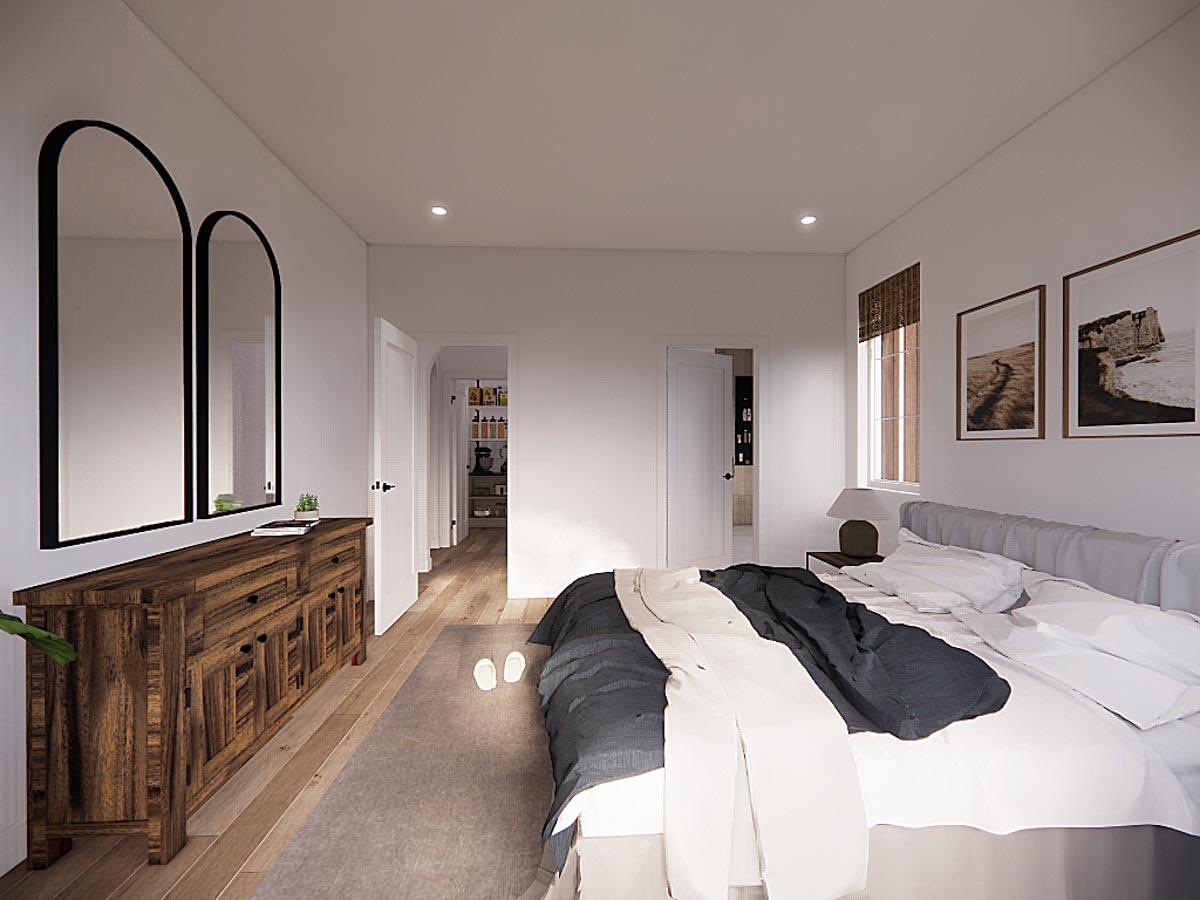 A modern bedroom features a large bed with a dark comforter and two arched mirrors above a wooden dresser, with open doorways.