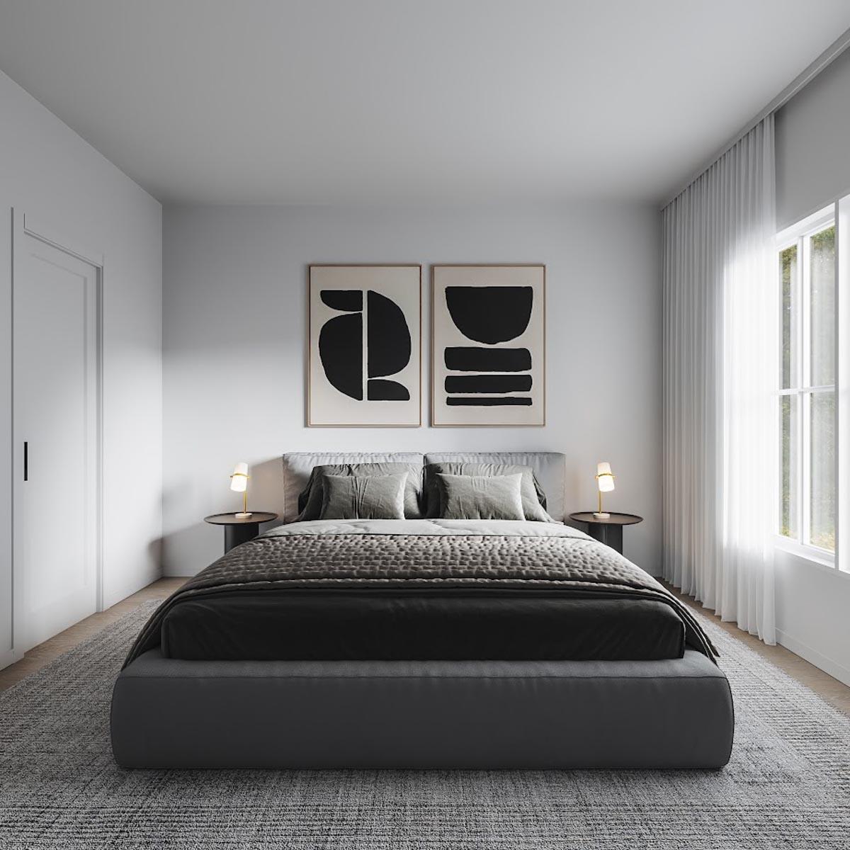 Bedroom interior with king bed, abstract art, bedside tables with lamps, and large window with sheer curtains.