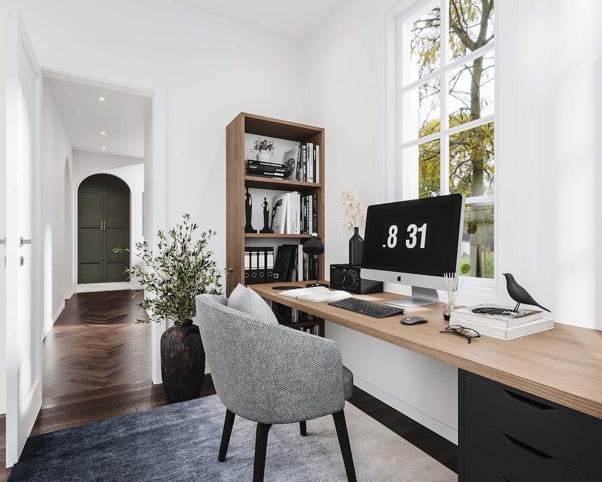 A modern home office with a minimalist desk setup, featuring a computer, books, and a view of the outside. Grey chair and bookshelf are also included.