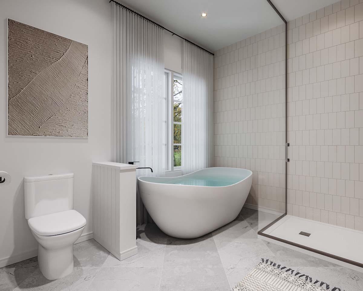 Modern bathroom featuring a freestanding oval bathtub filled with water, a walk-in shower, and a large window with sheer curtains. Gray tile floor.