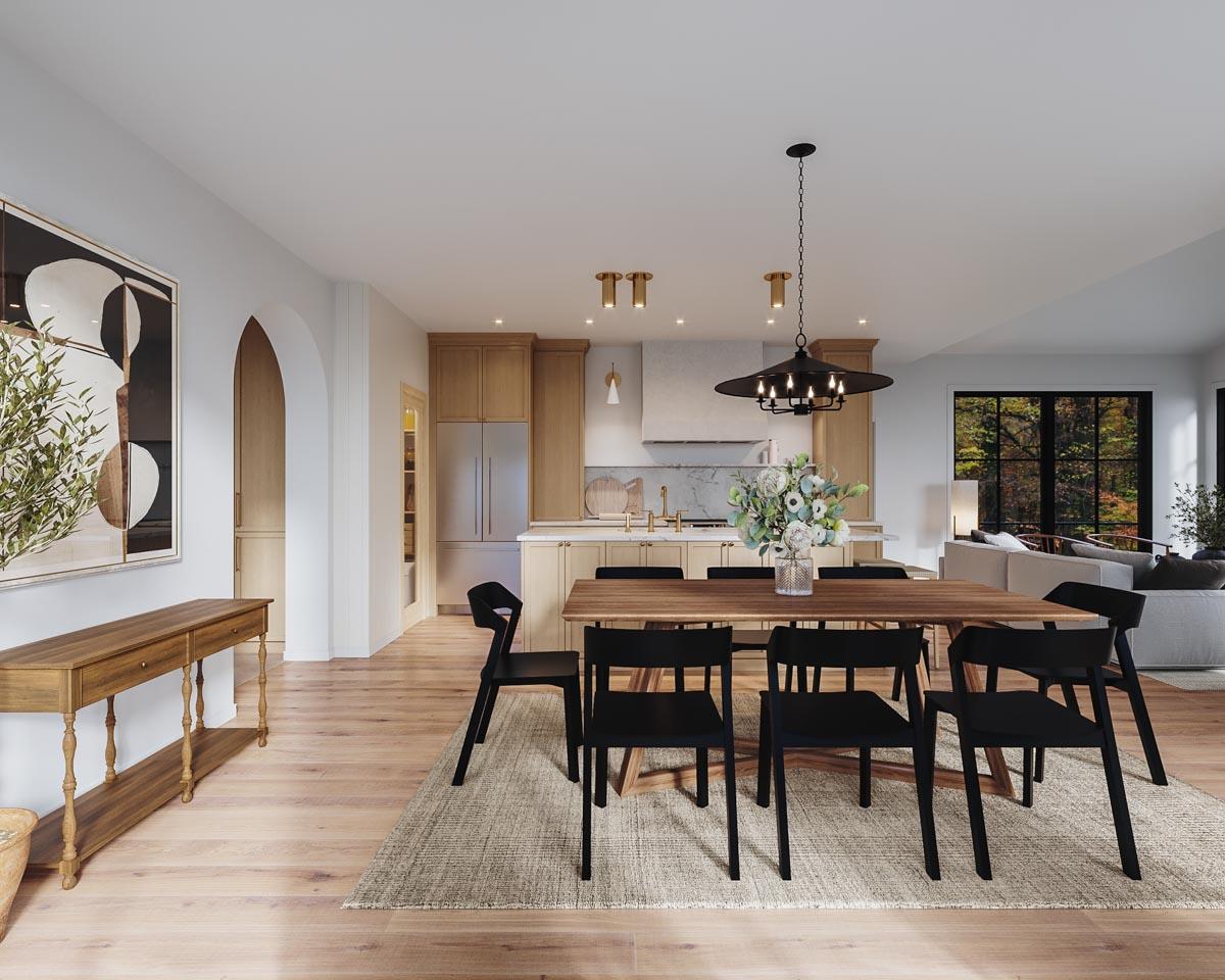 Open-concept dining area with wooden table and chairs, adjacent to a kitchen with wood cabinetry and stainless steel appliances.