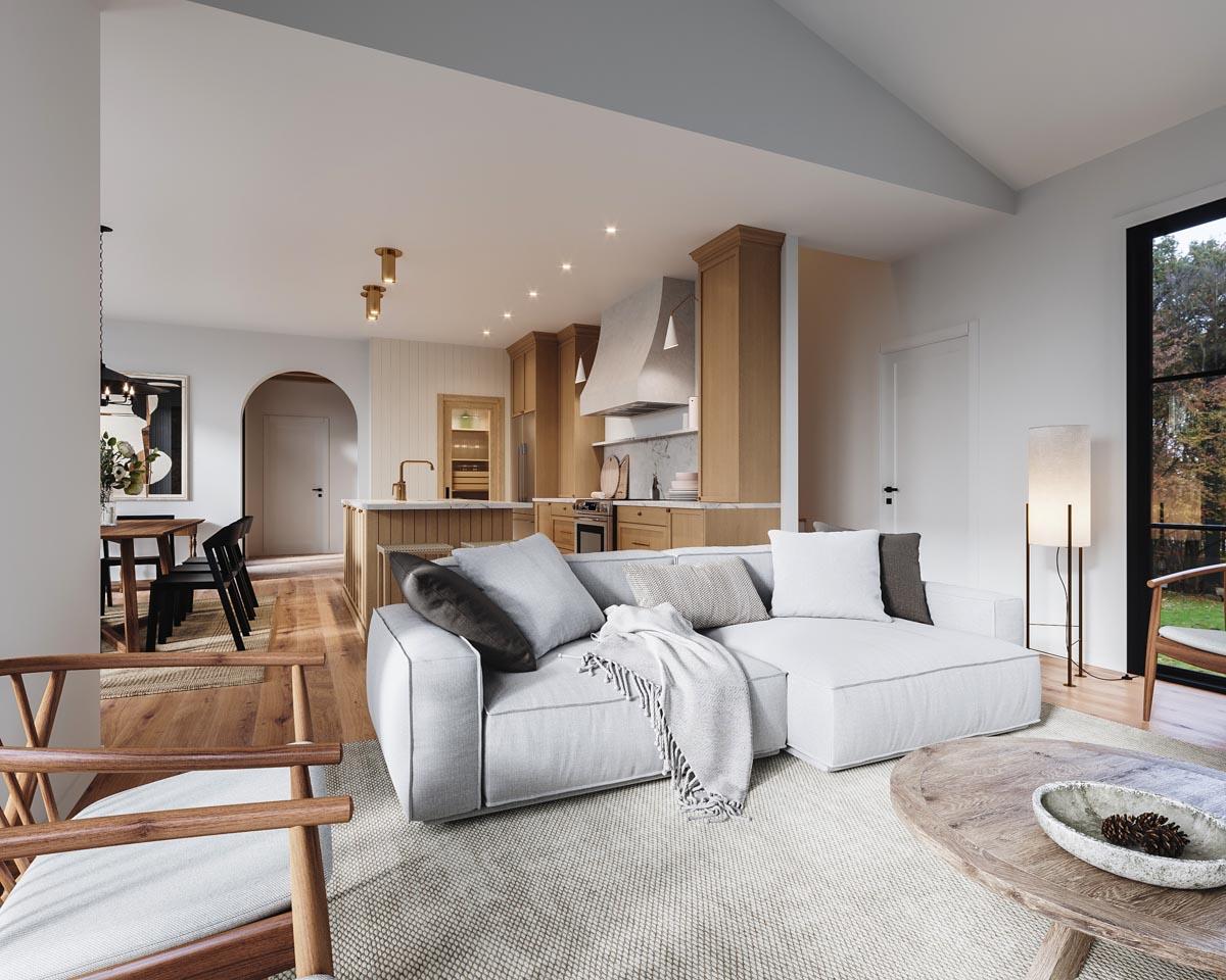 Open concept living space with sectional sofa, dining area, and kitchen featuring island and wood cabinetry.