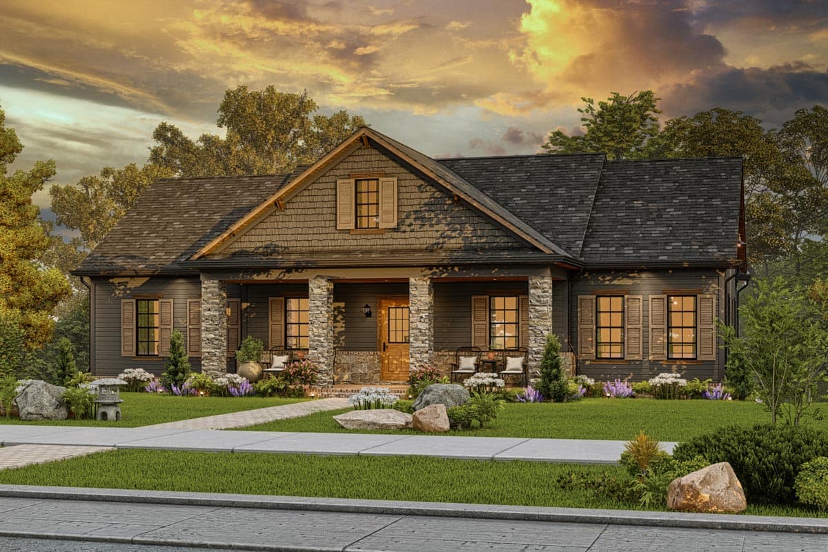 House plan exterior. Craftsman style, one-story home with stone-clad porch columns, gable roof, and shutters on windows.