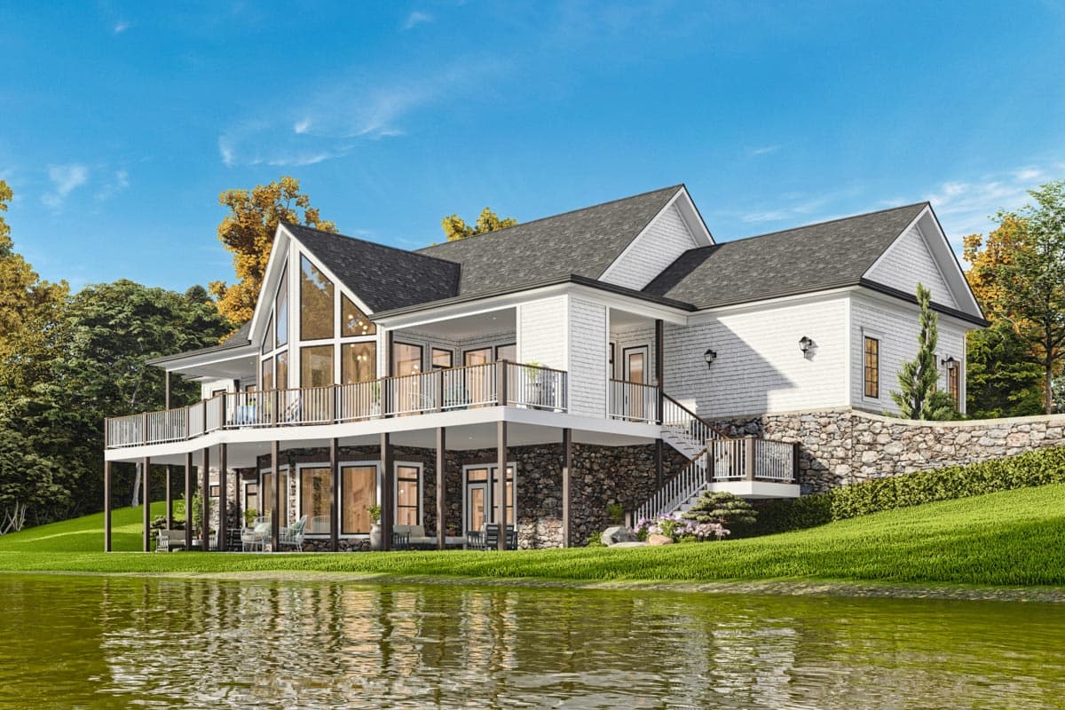 Modern house plan exterior with a multi-level deck, large gable windows, stone foundation, and shingle siding.