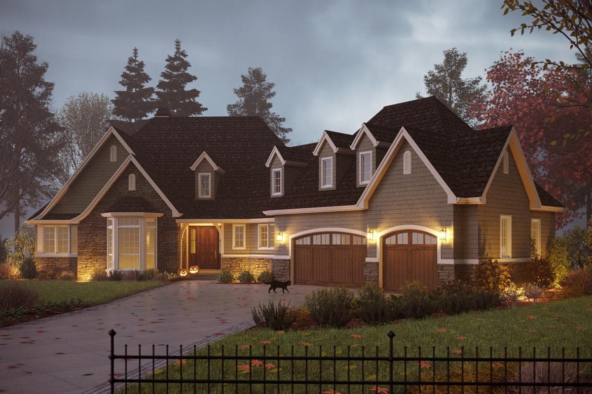 House plan exterior: two-story Craftsman style with stone and shake siding, prominent gables, dormers, and a three-car garage.