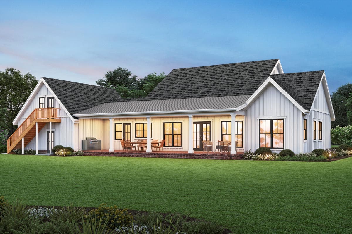 Modern Farmhouse house plan exterior with gabled roofs, covered porch, vertical siding, and an attached garage with upper-level access.