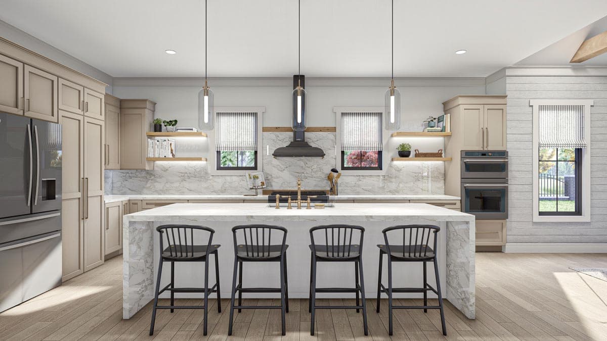Kitchen interior with large island, marble backsplash, double ovens, pendant lights, and light wood flooring.