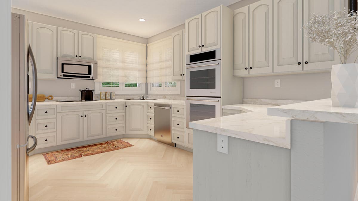 Kitchen interior with white cabinets, double oven, stainless steel refrigerator, dishwasher, and marble countertops.