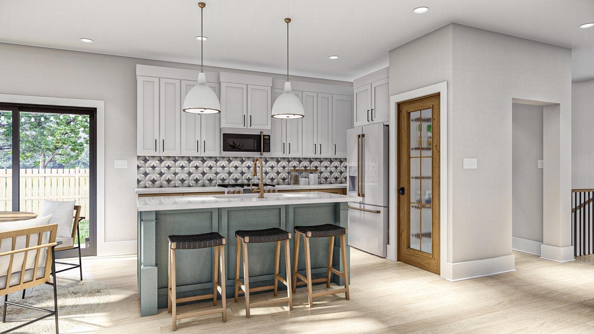 Kitchen with island, pendant lights, white cabinetry, patterned backsplash, and glass-paned door. Includes dining area with seating.