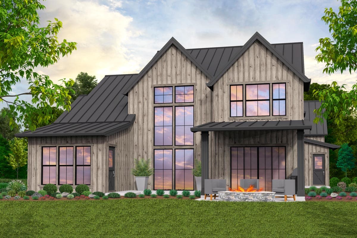House plan exterior: Modern Farmhouse style, two stories, vertical wood siding, gabled rooflines, covered porch, and large windows.