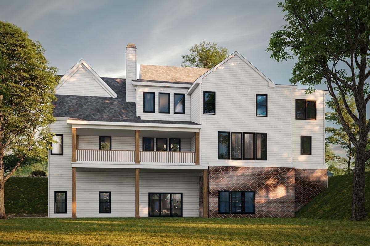 House plan exterior, white siding, brick foundation, covered deck, multiple gables, and a prominent chimney.