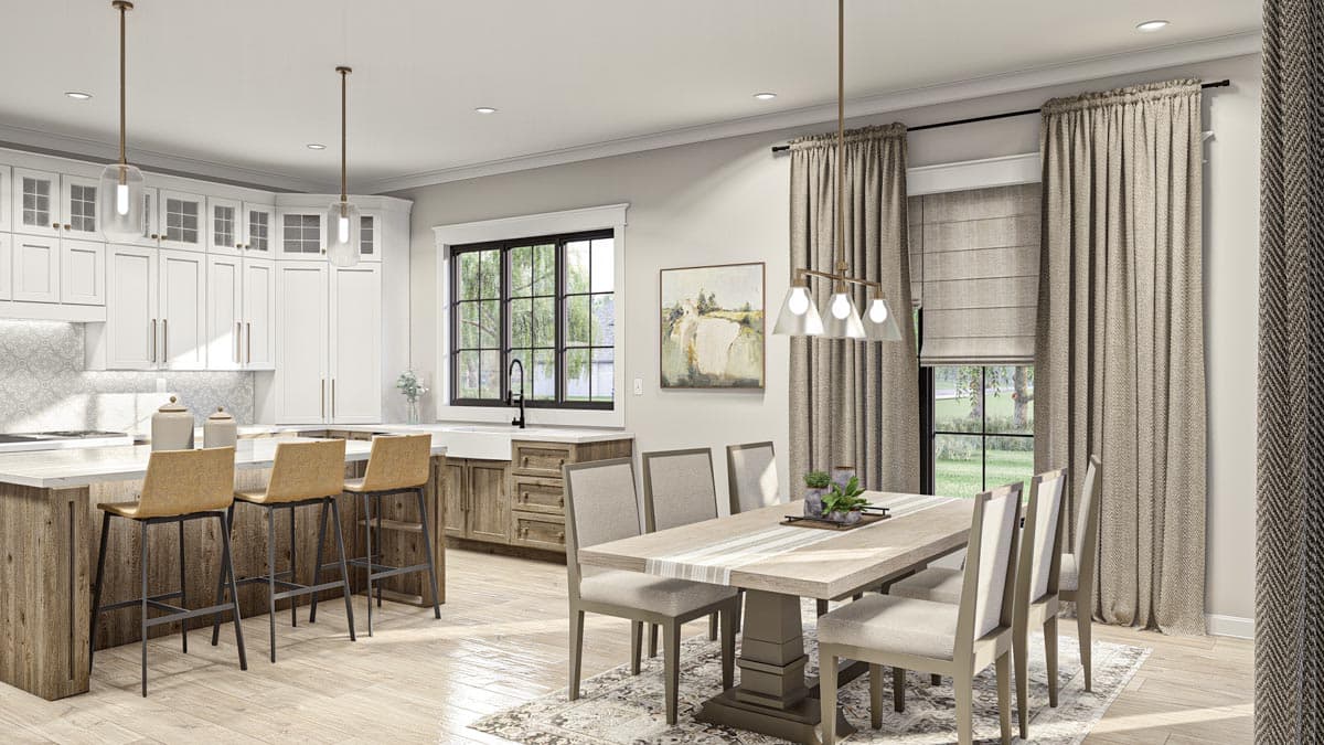Open-concept kitchen and dining area with island, white cabinetry, farmhouse sink, and dining table with chairs.