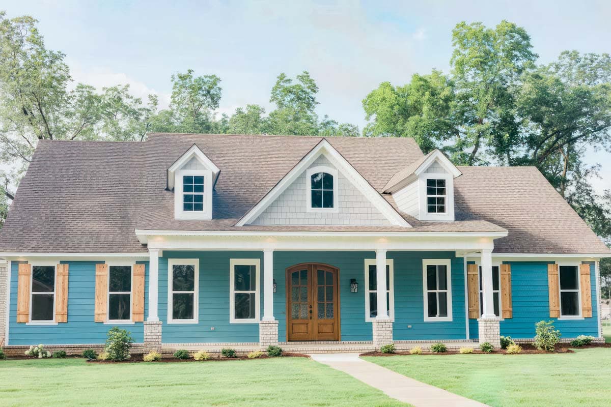 House plan exterior with Craftsman-style elements. Features include a front porch with columns, gables, and dormer windows. Two-story structure.