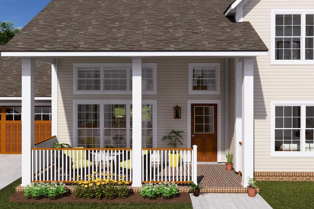 House plan exterior: Two-story home with a wrap-around porch, white railings, dormers, and a side-entry garage.