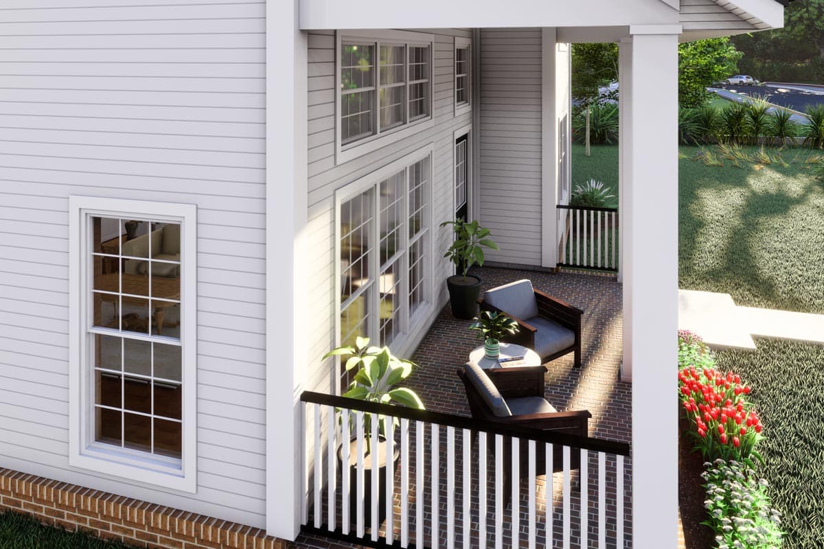 House plan exterior with covered porch, brick flooring, multiple windows, and white railings.