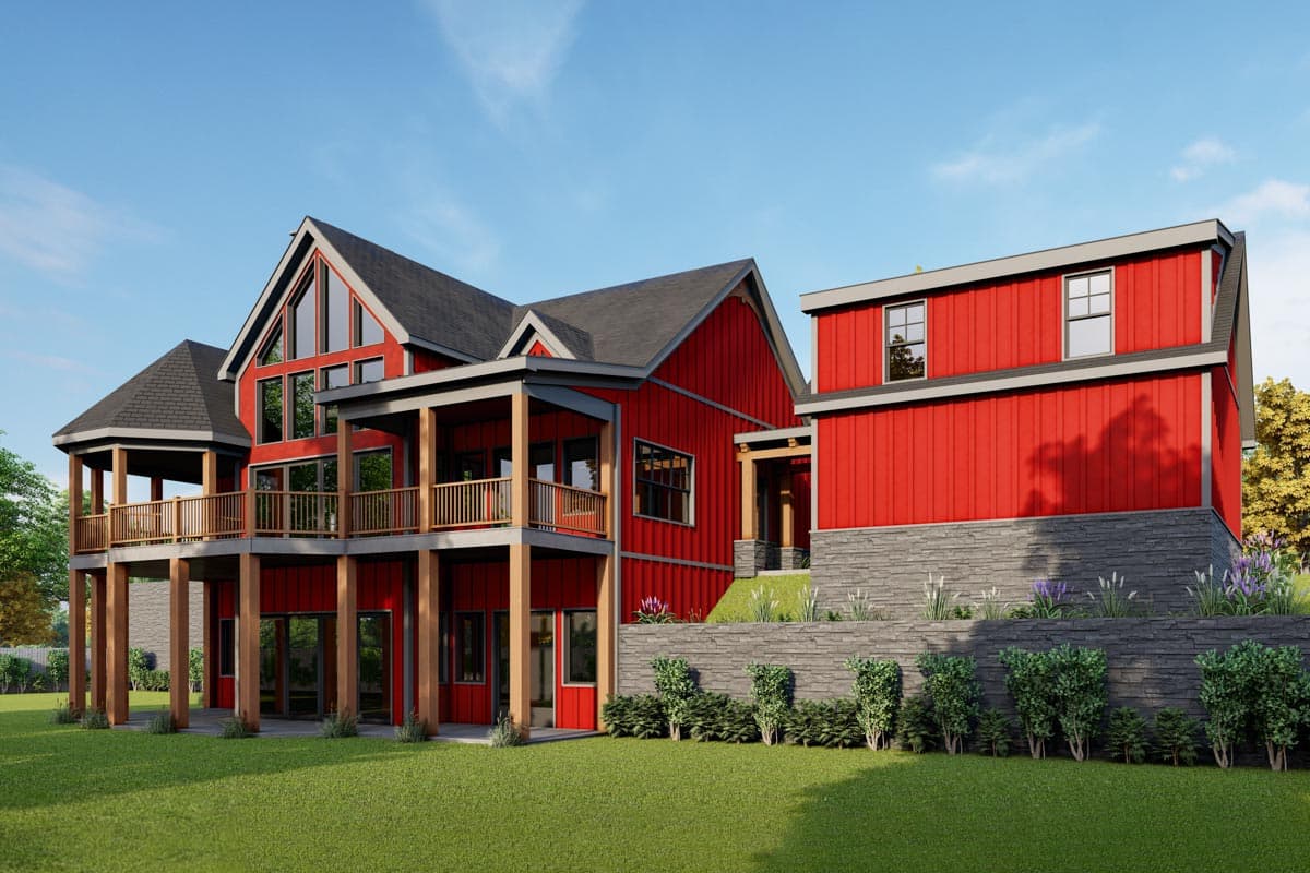 House plan exterior showing a two-story modern home with a wraparound deck, prominent gables, and large windows.