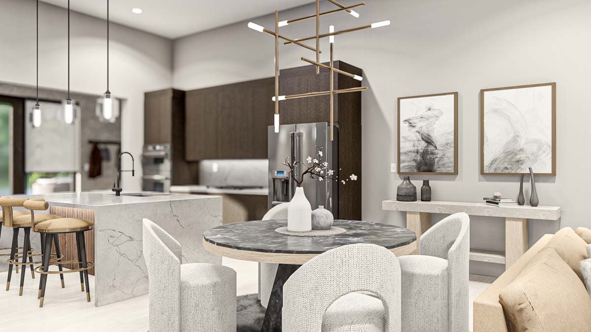 Modern kitchen and dining area with marble island, dining table, pendant lights, and stainless steel refrigerator.