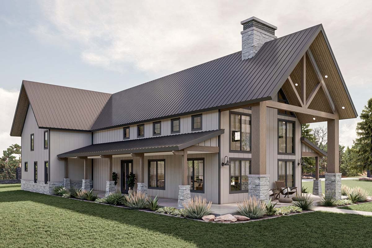 Modern farmhouse house plan exterior with metal roof, stone accents, wrap-around porch, and prominent gables.