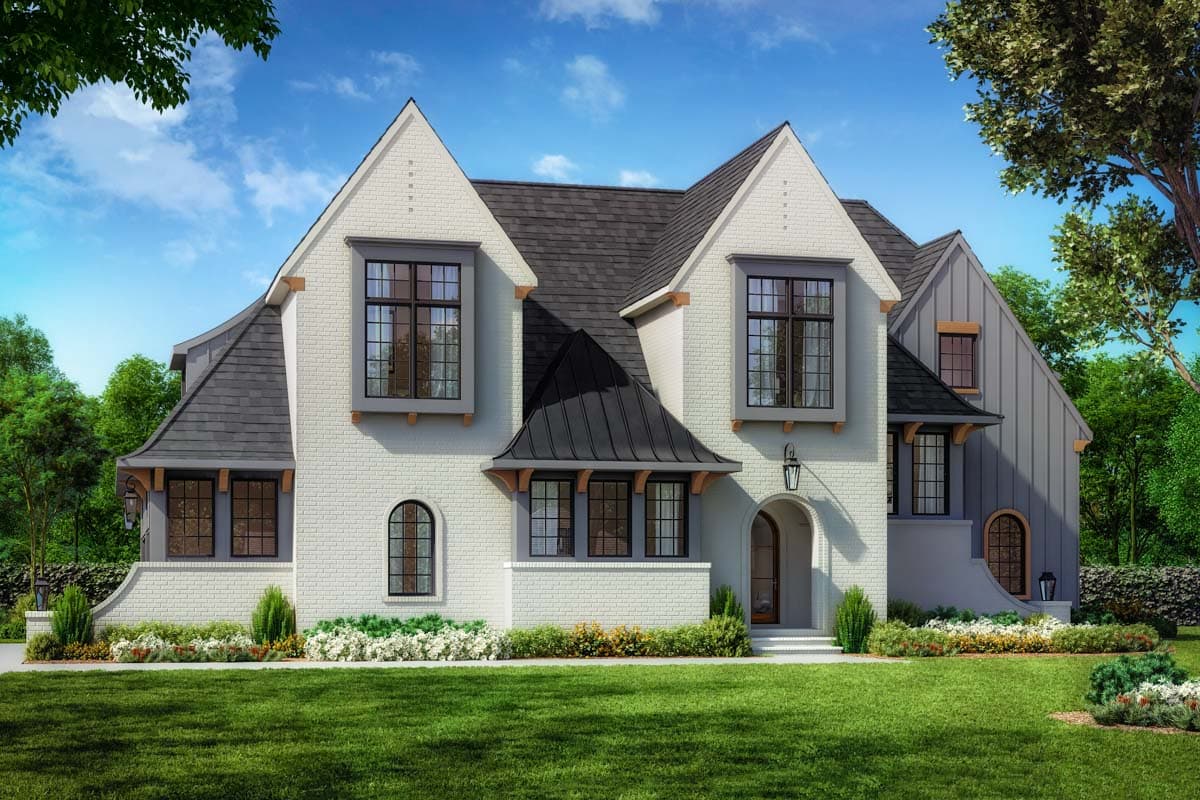 House plan exterior. Two-story English Tudor with gables, a hipped roof, and arched doorway. Features include a brick facade and dormers.