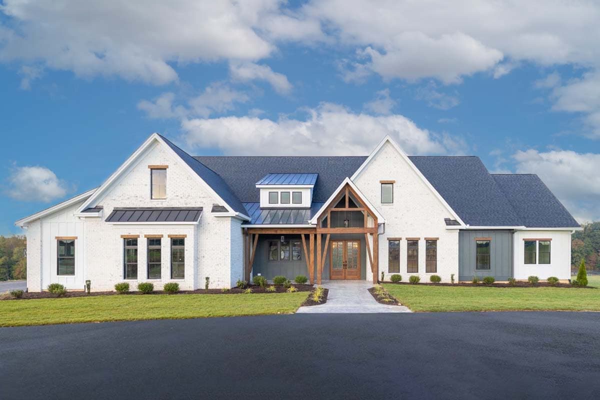 House plan exterior with Modern Farmhouse style. Features include gabled roof, timber-framed entry porch, multiple dormers, and dark-colored roofing.