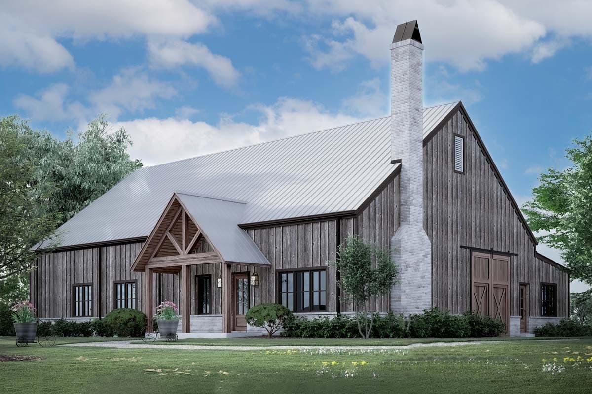 House plan exterior. Two-story barn-style home with metal roof, large brick chimney, and covered porch with gable roof detail.