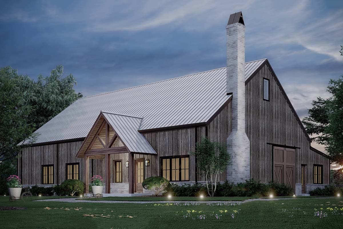 Modern farmhouse house plan exterior with metal roof, wood siding, stone chimney, covered entryway, and large barn-style doors.