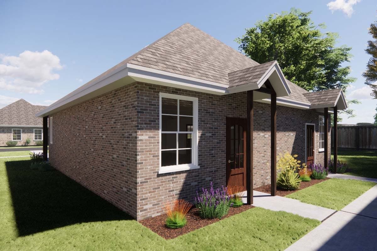 House plan exterior. One-story brick home with multiple gabled entrances, a covered porch, and white-trimmed windows.