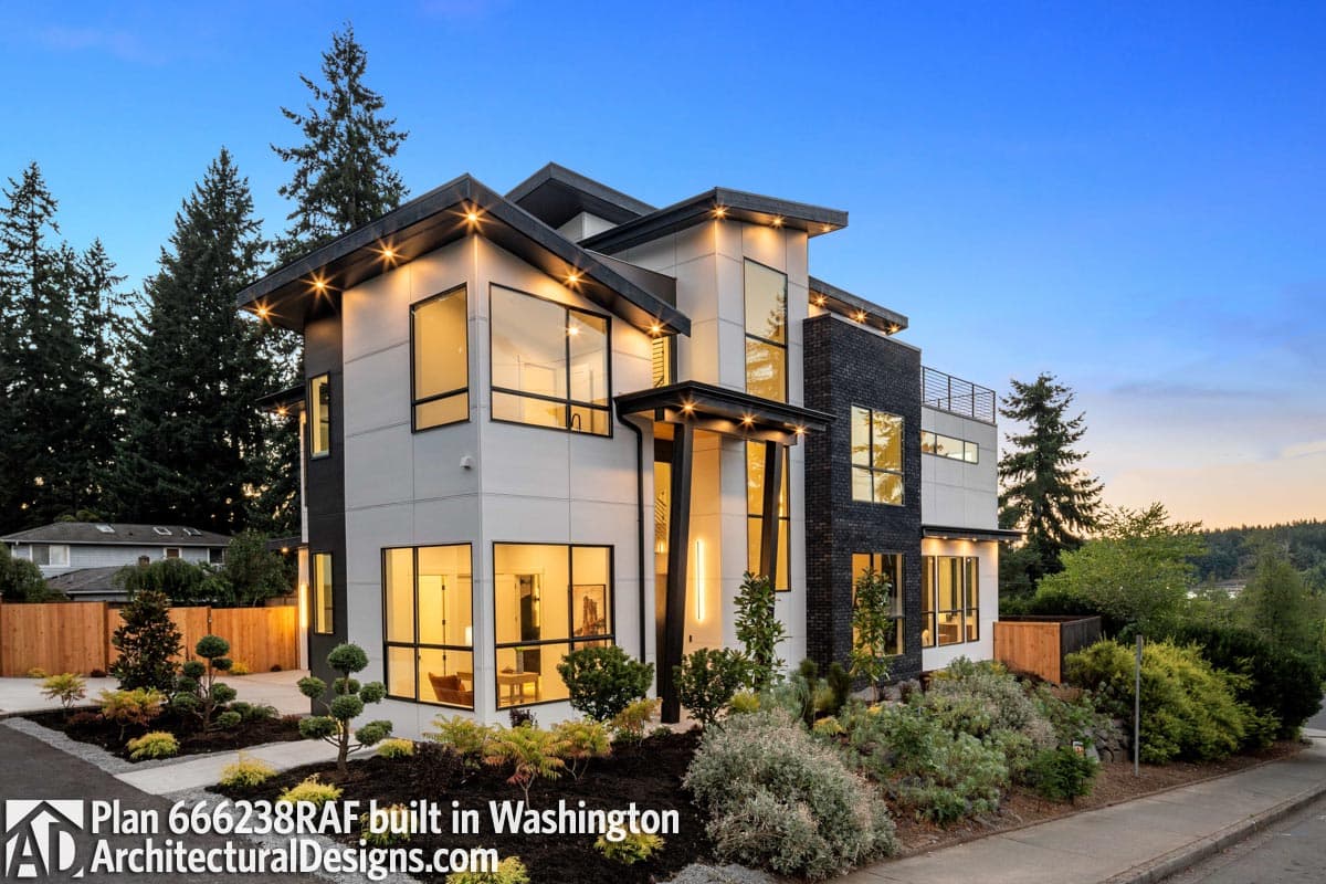 Modern house plan exterior, 3 stories, with multiple gables, large windows, and a flat roof.