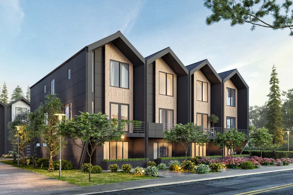 Modern townhouse exterior with dark siding, wood paneling, steep gables, and balconies.