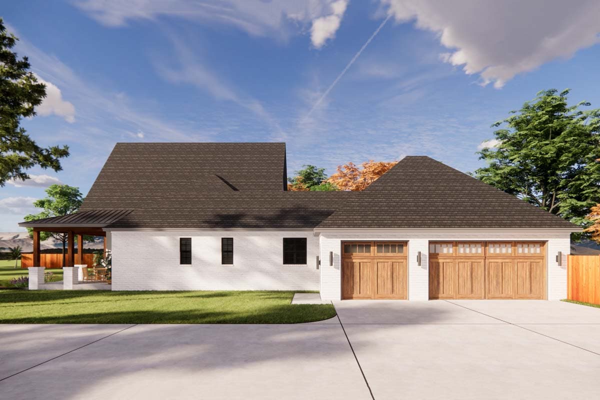 House plan exterior: White brick, hip roof, two-car garage with wood doors, covered porch with wood posts.