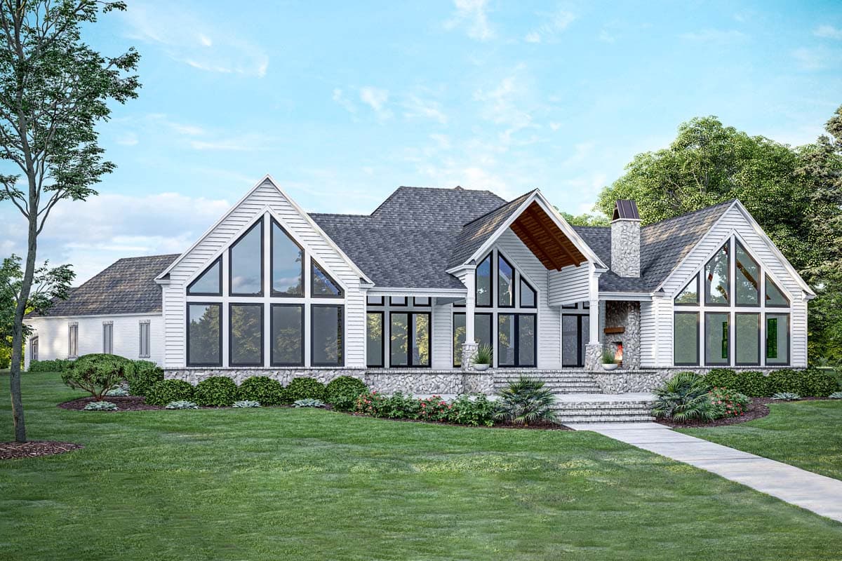 House plan exterior: Modern farmhouse style, one story, with large gabled windows, stone foundation, and prominent chimney.