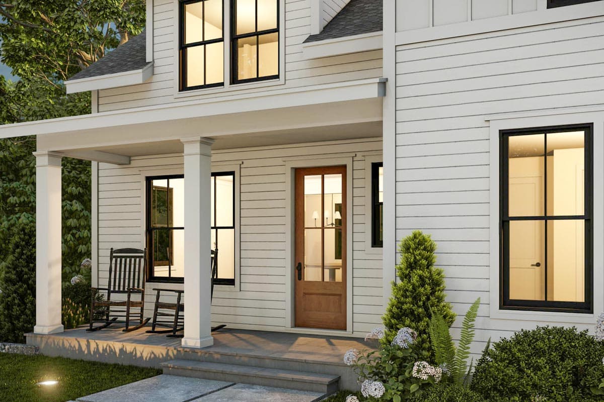 Modern Farmhouse house plan exterior with a covered porch, white siding, wood front door, and black grid windows.