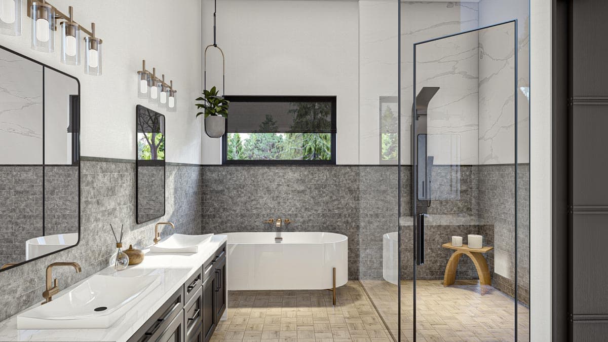 Modern bathroom featuring a soaking tub, glass shower, and double vanity. Accented with gold fixtures, gray tile, and a decorative plant.