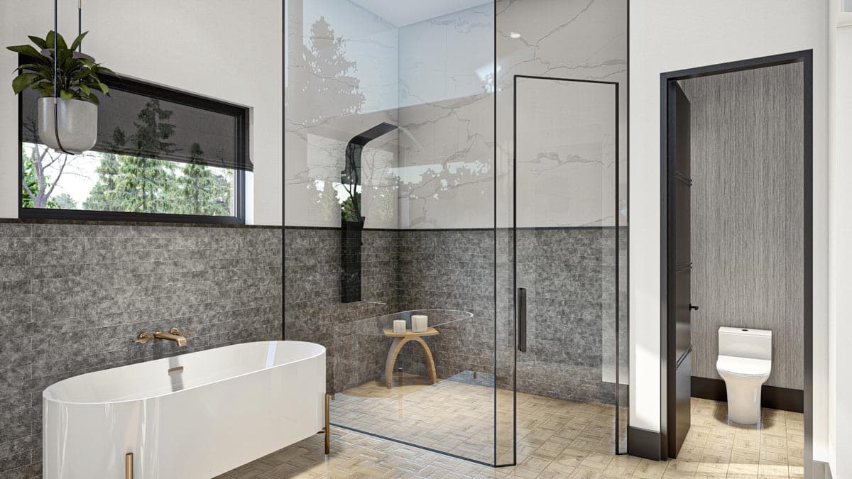 Modern bathroom with a white bathtub, glass shower, and a view of trees through a window. Features neutral tones and a minimalist style.