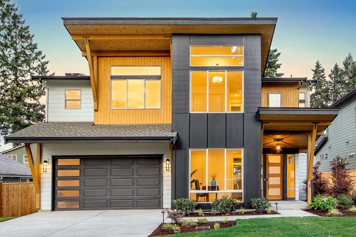 House plan exterior. Modern style, two-story home with flat rooflines, wood accents, and a covered entry. Includes garage with glass panel doors.