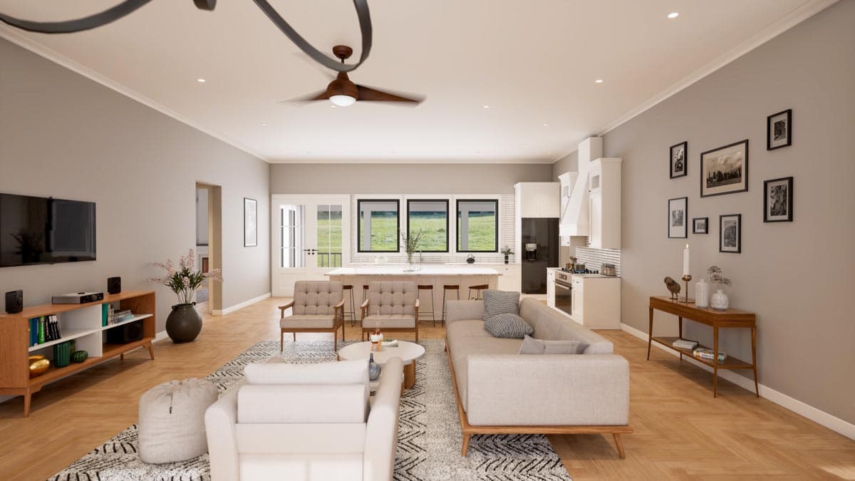 Open concept living area with kitchen island, sectional sofa, and media console. Three windows overlook a green field.