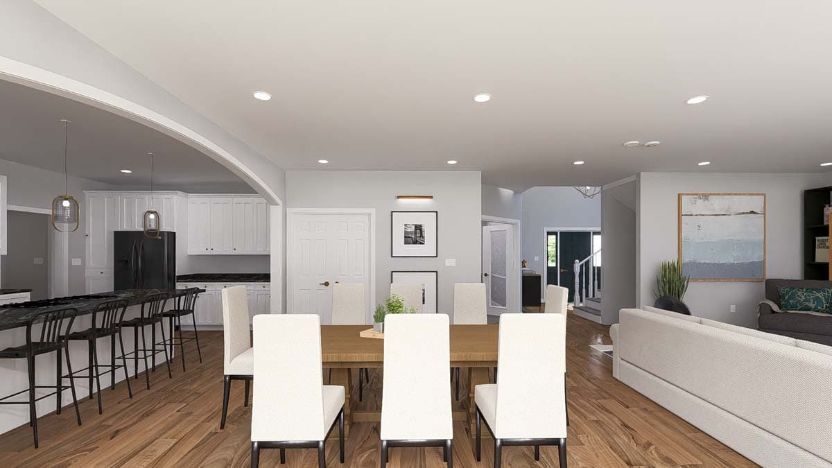 Open-concept home interior rendering with kitchen island, dining area, and living room with sofa and fireplace.