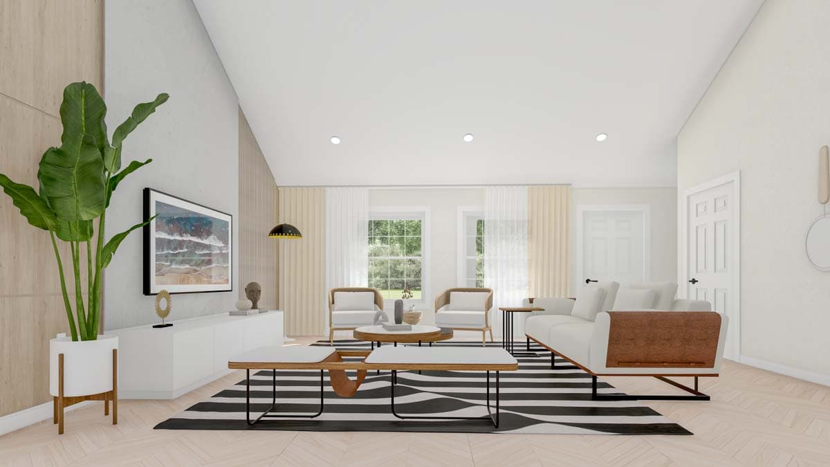 Great room with vaulted ceiling, fireplace, large windows, open layout, and a sectional sofa.