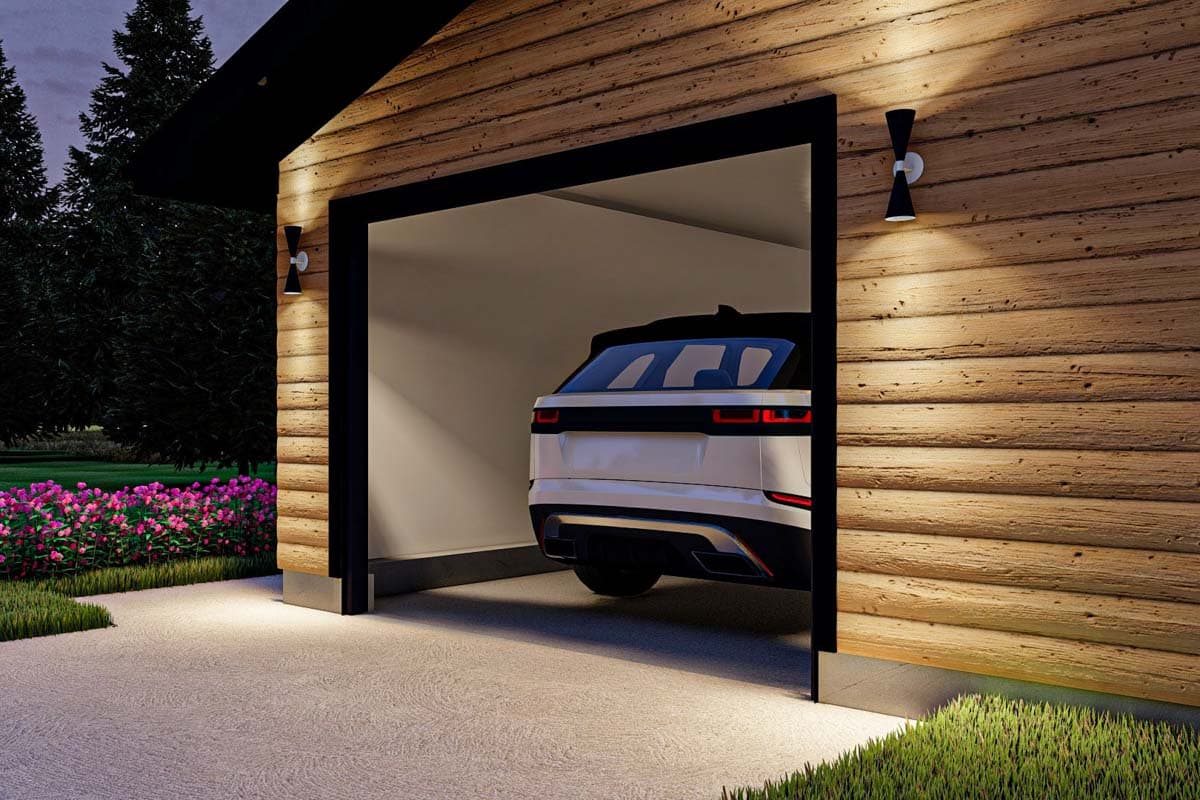 Exterior house plan featuring horizontal wood siding, a modern garage door, and exterior lighting.